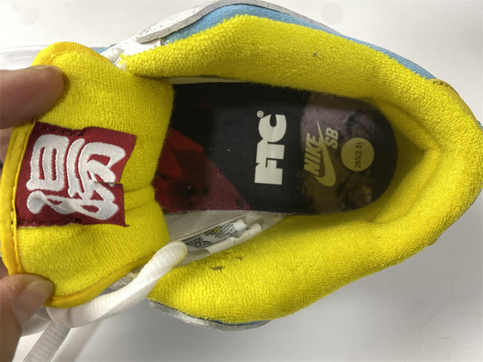 how the ftc x nike sb dunk low looks on-feet dh7687-400